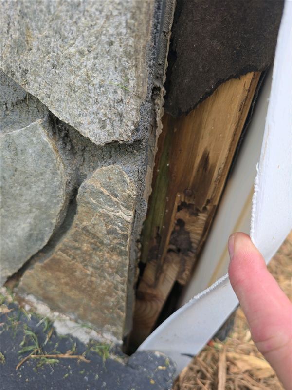 Deteriorated wood found behind a piece of exterior trim