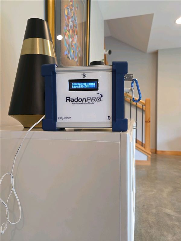 Continuous radon monitor set up in a home during a radon test