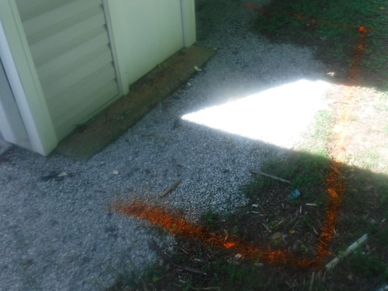 Septic tank location outlined in marking paint